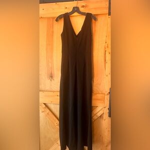 Long black dress with slit.